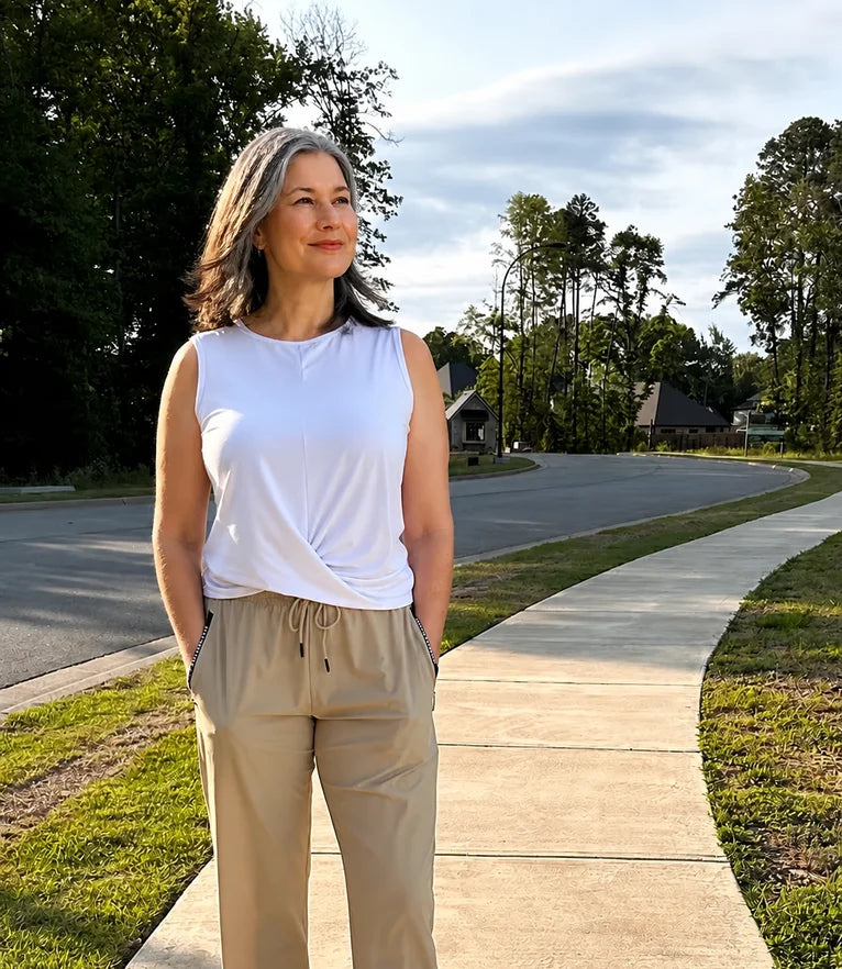 Donna standing on her street, 30 days in