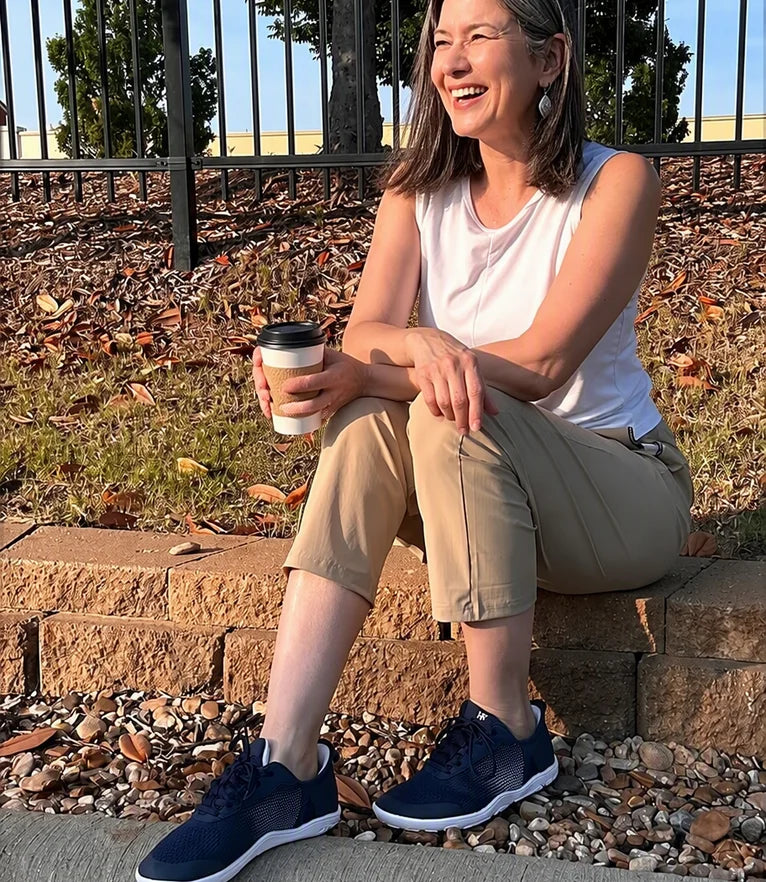 Donna laughing on the stone steps